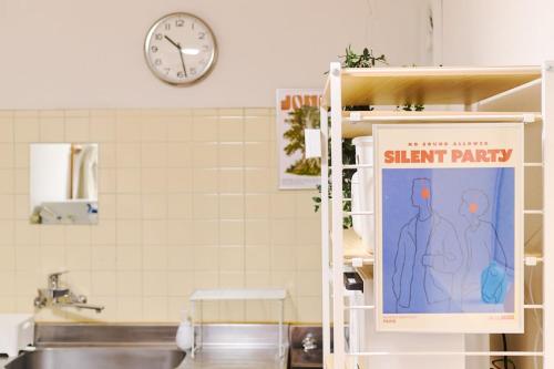 a kitchen with a sign that reads silent party at Kokonimo Niiza in Niizo