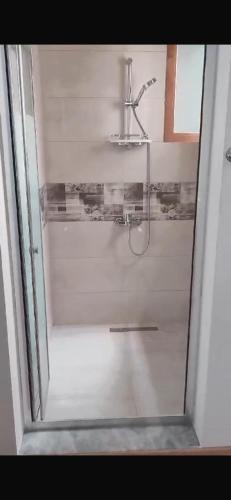 a bathroom with a shower with a sink at Old Stone Boutique Hotel in Lefkosa Turk
