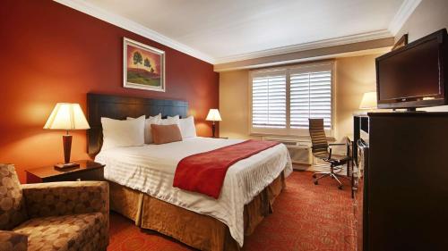 a hotel room with a bed and a television at Best Western Burbank Airport Inn in Los Angeles