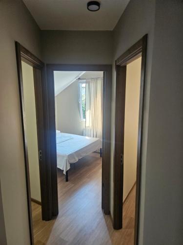 a bedroom with a bed and a mirror at George House in Batumi