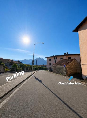 a street with a street light on the side of a road at Oasi Lake Iseo in Solto Collina