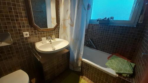 a bathroom with a sink and a toilet at Ferienappartement in der Spielestadt in Ravensburg