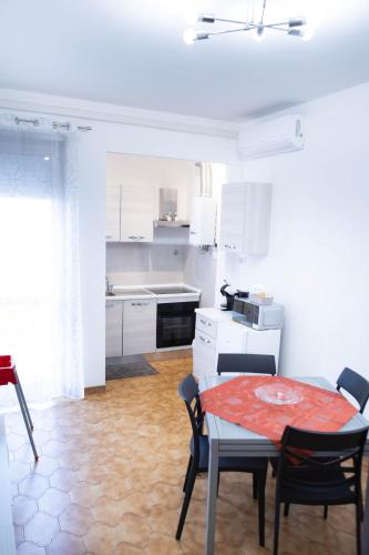a kitchen and dining room with a table and chairs at House Santa Rita in Turin