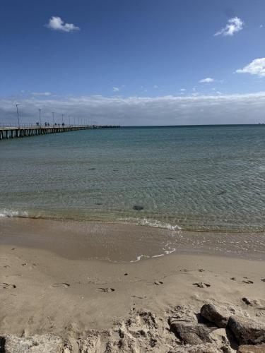 a beach with a pier in the water at Casa Piccolo - Peninsula Hot Springs 5 mins away in Rye