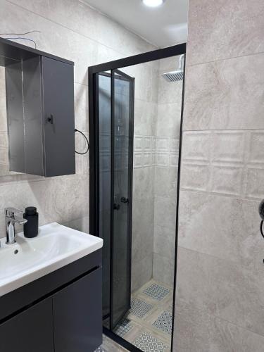 a bathroom with a shower and a sink at Elia Hotel Alaçatı in Çeşme
