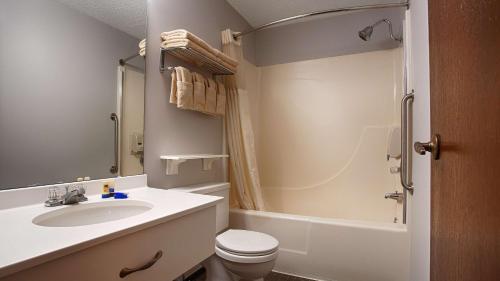 a bathroom with a sink and a toilet and a shower at Best Western La Grande Hacienda in Cherokee