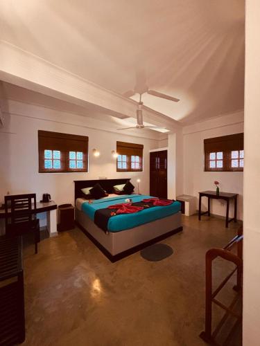 a bedroom with a bed in a room at Seagreen Guesthouse - Galle Fort in Galle