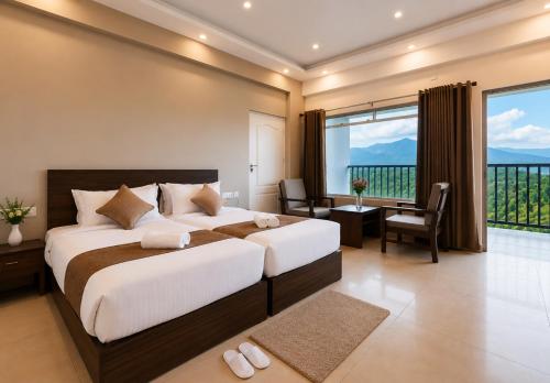 a bedroom with a large bed and a large window at Pleasant Hill Resort - Munnar in Munnar