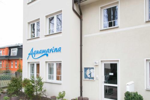 a building with aania sign on the side of it at Bansin, Aquamarina WG 10 in Bansin