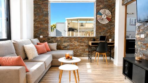 a living room with a couch and a table at JVG VILLAS - Villa Joval in Güimar