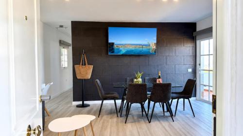 a dining room with a table and chairs at JVG VILLAS - Villa Valeria in Güimar