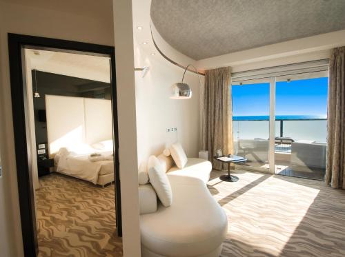 a hotel room with a view of a bedroom at Hotel Premier & Suites - Premier Resort in Milano Marittima