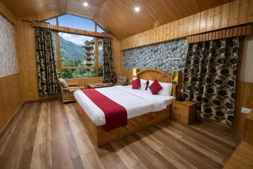 a bedroom with a bed and a large window at Woods Villa Cottages Manali - 1,2,3,4 Bedrooms Luxury Cottages & Villa Available in Manali with Scenic Mountain View, Manali in Manāli