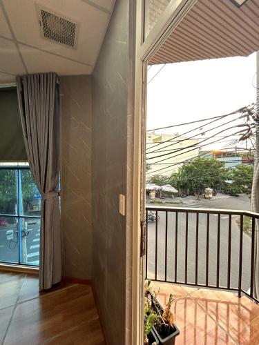 a balcony with a view of a street at Linh's House in Danang