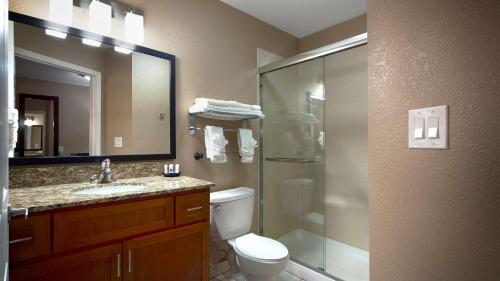 a bathroom with a shower and a toilet and a sink at Best Western Plus Crawfordsville Hotel in Crawfordsville