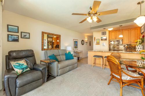 a living room with a couch and a table at SUGAR BEACH RESORT #412 in Kihei