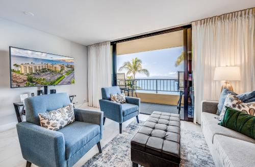 a living room with a couch and a chair at SUGAR BEACH RESORT, #PH27 in Kihei