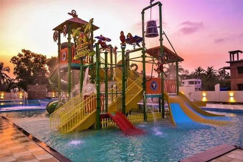 a water park with a slide in a pool at Shore Appartments in Udupi