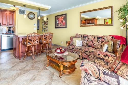 a living room with a couch and a table at SUGAR BEACH RESORT, #131 in Kihei