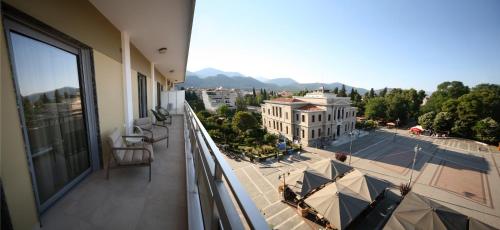 an apartment balcony with a view of a building at Arcadian Design Loft in Tripoli