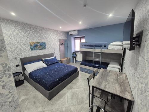 a bedroom with a bed and a desk in a room at B&B Monviso in Casavecchie