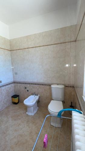 a bathroom with a toilet and a bidet at casa di malika in Borgo Venusio