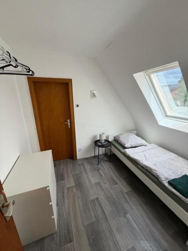 a small room with a bed and a window at Monterus Fürst in Fürstenau