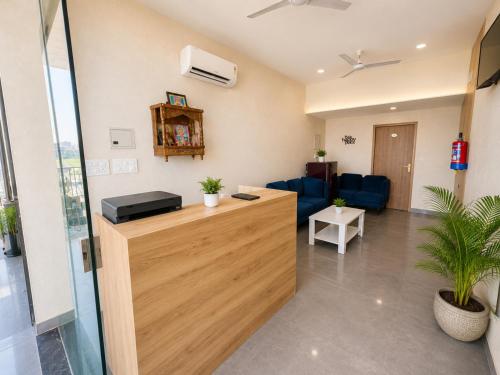 an office with a reception desk and a waiting room at Hotel Olive Sunny Enclave, Near Airport Road, Mohali in Kharar