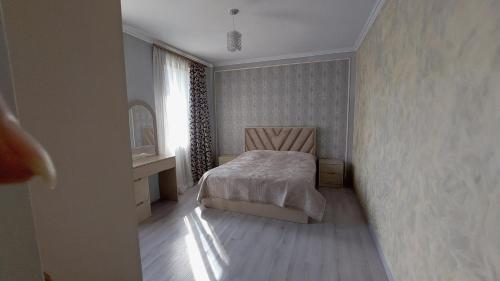 a bedroom with a bed and a window at Igor Bed and Breakfast in Halidzor