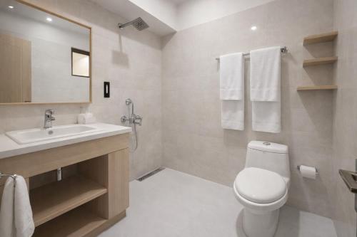 a bathroom with a toilet and a sink at The Spring Dale Resort, Mussoorie by Sitara group - Best Selling Resort in Mussoorie 2025-26 in Mussoorie