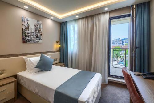 Krevet ili kreveti u jedinici u objektu Aurora Sofia Hotel