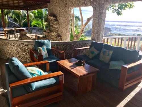 a living room with a couch and a table at Tanna Evergreen Resort & Tours in Tanna Island