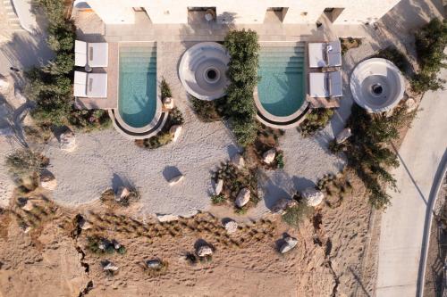 an overhead view of a resort with two pools at Eunoia Suites in Krotiri