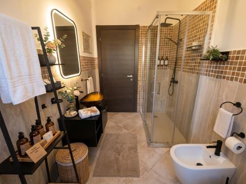 a bathroom with a shower and a sink at Gioia B&B in Cirò Marina