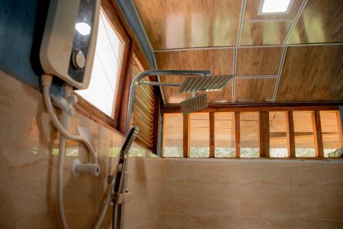 a bathroom with a shower in a room at Little Pumpkin Cabanas & seafood restaurant in Tangalle