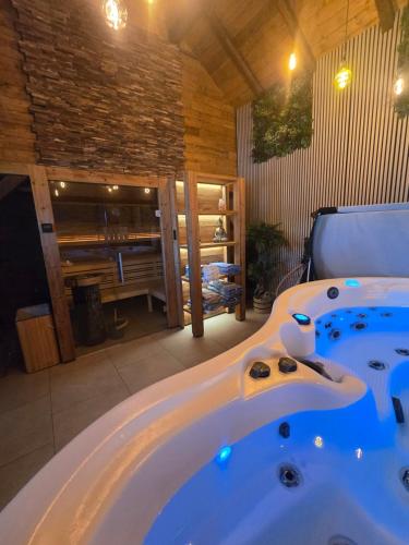 a large bath tub in a room with a room at Karolingerweg Gäst Haus in Lauterhofen