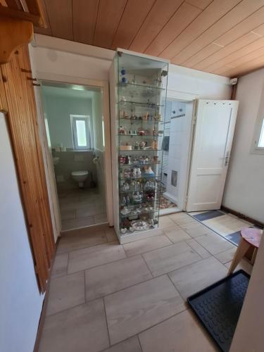 a bathroom with a toilet and a walk in closet at Haus Kern in Hallstatt