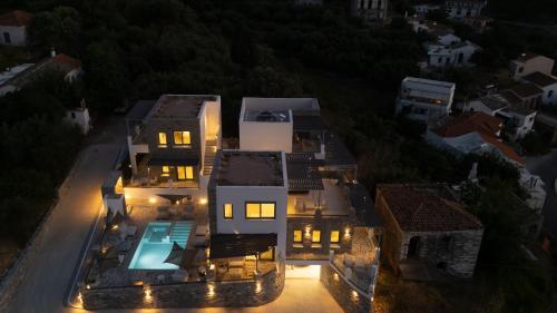 an aerial view of a house at night at Sofrano Luxury Apartments in Evdilos