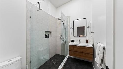 a bathroom with a glass shower and a sink at Olive Oak by AvantStay in Glen Ellen