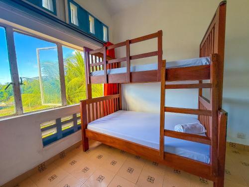 two bunk beds in a room with a window at Oceana Villa in Mombasa