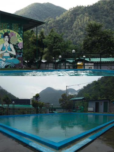 a pool with a view of a mountain at Maasa Retreat & Resort in Shivpuri