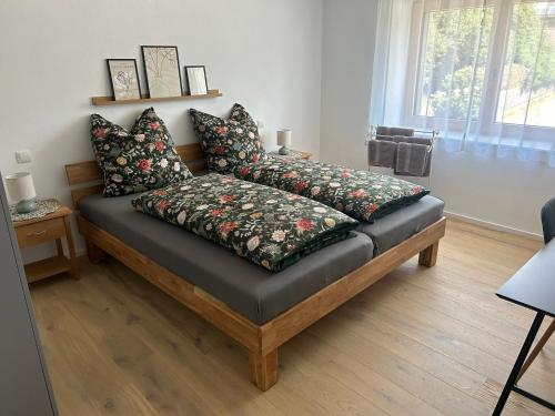 a couch with pillows on it in a living room at Ferienhaus im Günztal in Lauben