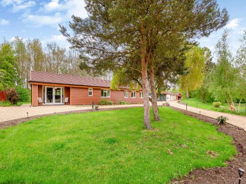 a house with a tree in the yard at Swallow - Uk41035 in Marston