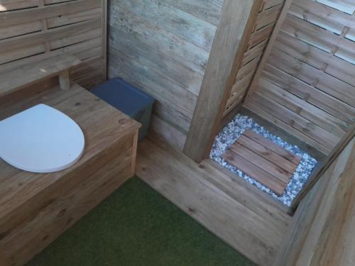 an inside view of a sauna with a toilet at Chez Flo&Fred Caravane Vintage in Barbery