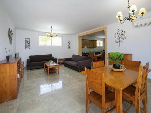 a living room with a table and a dining room at Villa Villa Delfín by Interhome in Calpe