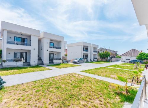 an image of a house with a driveway at Bumax Apartments in Ulcinj