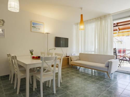 a living room with a dining room table and chairs at Apartment Pamela by Interhome in Balatonőszöd