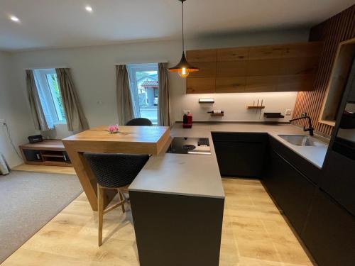 a kitchen with a table and a counter top at Ascona Casa Mamina A in Ascona