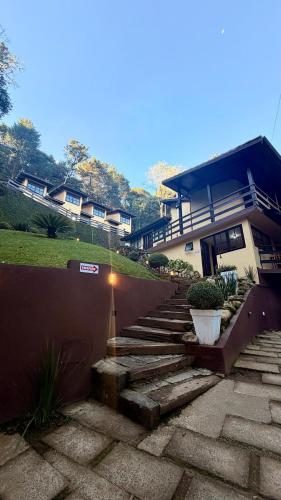 a set of stairs in front of a house at Villa di Serra by Concavus in Monte Verde