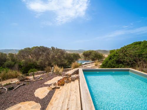 a swimming pool with a view of a mountain at Villa Sa Blanca by Interhome in Es Mercadal
